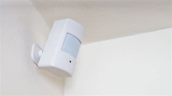 How do you turn on motion sensors on a camera?